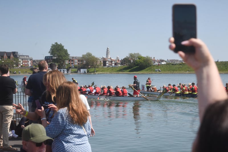 Spectators were eager to capture the Blue Skies Dragon Boat Festival action at Fairhaven Lake.