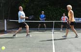 Pickleball players take part in a doubles match in Chorley