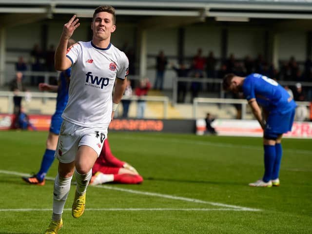 Nick Haughton celebrates the third of his four goals against Leamington  Picture: STEVE MCLELLAN