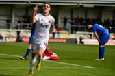 Nick Haughton celebrates the third of his four goals against Leamington  Picture: STEVE MCLELLAN