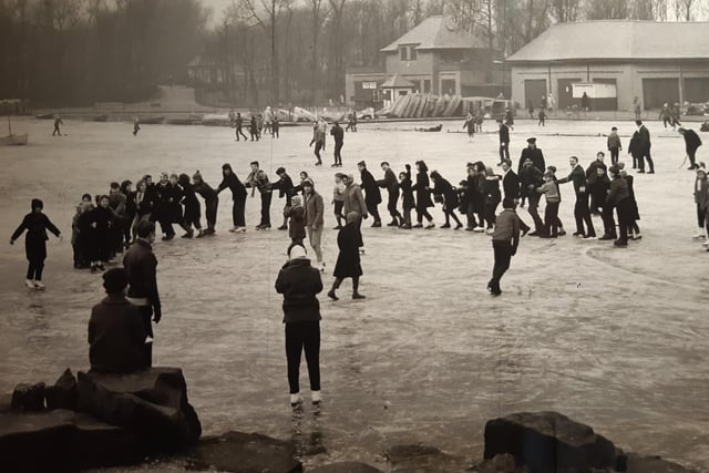 This was December 1961 and school children were making the most of the a frozen Stanley Park lake with a celebratory conga