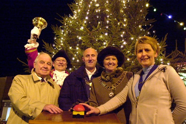 Announcing Garstang's big Christmas lights switch-on in 2000 is town crier Denis Hollowday with town Mayor and consort, Coun Mrs Norah and Henry Hoyles, Chamber Of Trade chairman Gail O'Brien, and Town Trust chairman Eddie Livesey
