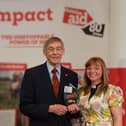 Arton Medd receives his award from Rev Kate Bottley