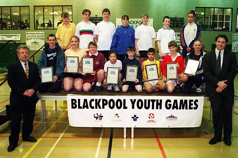 Director of community services, Richard Nulty (left) and Joel Lavery (right) present representatives from the eight participating schools with certificates at the opening ceremony of Blackpool secondary schools youth games
