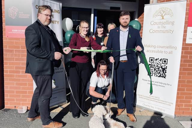 Fleetwood MP Cat Smith cuts the ribbon as Counselling in the Community opens new amenity in Fleetwood. Pictured left is founder/CEO  Stuart Hutton-Brown, with trustee Chris Webb on the right