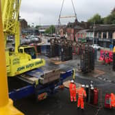 Old signalling gantry lifted out by crane near Macclesfield as part of the upgrade of the West Coast Main Line
