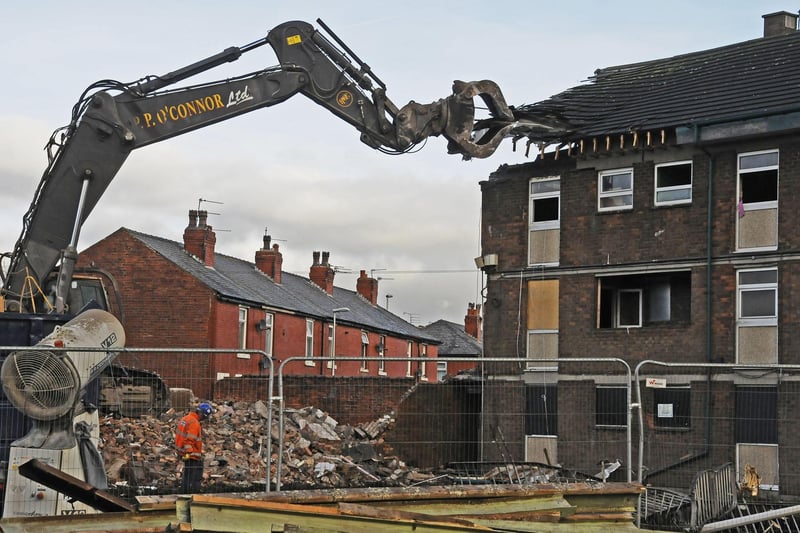 The last of the maisonettes at Queen's Park being demolished.