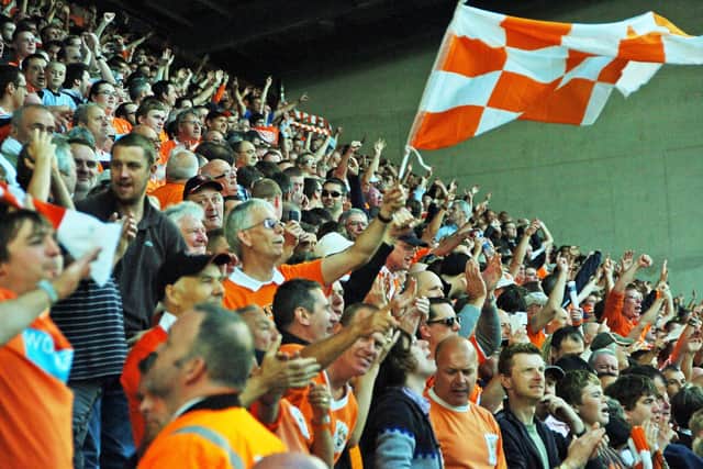 Blackpool fans celebrate their side's stunning opening day win