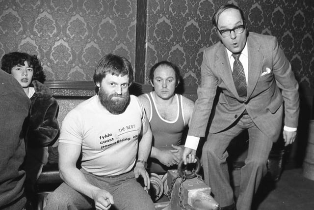 The two men in the centre were both weightlifters taking part in a competition at Kirkham. But who is the man attempting to lift the heavy anvil?