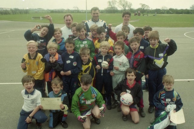 A Lancashire factory scored with youngsters after holding an Easter soccer school for them. Staff at British Aerospace's Warton site, near Blackpool, invited children at local schools and the children of employees to their four football courses run by the Lancashire Football Association. The children are pictured with PNE's Glenn Johnstone and coaches Darren Bowles and Tony Duckworth