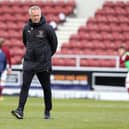 NORTHAMPTON, ENGLAND - MAY 01:  Blackpool manager Neil Critchley looks on during the pre match warm up prior to the Sky Bet League One match between Northampton Town and Blackpool at PTS Academy Stadium on May 01, 2021 in Northampton, England. (Photo by Pete Norton/Getty Images)