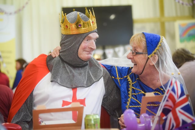 King Henry the Eighth, a St George, and a couple of medieval queens were in attendance. Pictured are John White and Ann White.