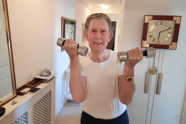 Bill Dobie in the home gym he set up to maintain his fitness regime during lockdown after beating Covid-19.