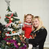 The Whittaker family are getting ready for Evie-Mae's first normal Chirstmas following hospital treatment.  Pictured L-R are mum Emma, sisters Ella-Mae, 4, and Evie-Rae, 2 with dad Andy.