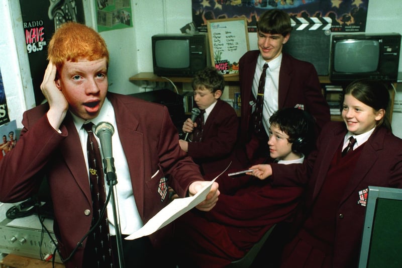 15-year-old Paul Witter broadcasts from Montgomery High School Radio Studio helped by the rest of the production team (left to right) Richard Neale 12, Peter Graham 15, Claire Graham 14, Sally Wilson 12