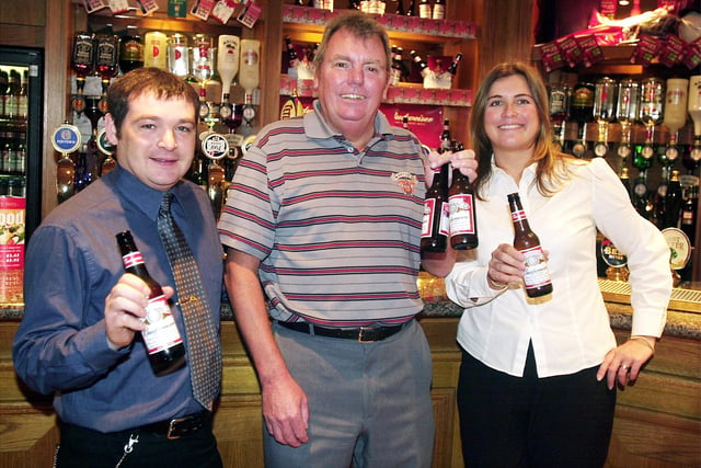 Neil Warrilow in the Litten Tree who had won tickets to see MUFC play in the United States. L-R are deputy manager of the Litten Tree Peter Herdman, Neil Warrilow and assistant general manager Jeanette Clay, 2003