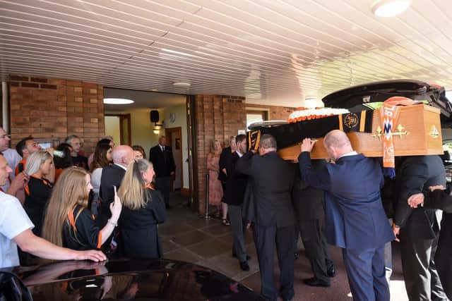 Chris Beveridge's coffin is carried into Lytham Crematorium