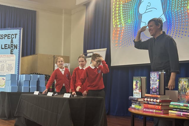 Jeff Kinney interacts with pupils at Hawes Side Academy in Blackpool