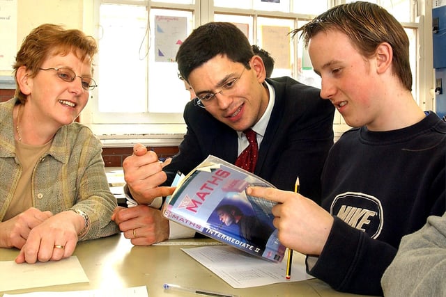 School standards minister David Miliband talking to Year 11 pupil Liam Atkinson and teacher Barbara Aldridge, in a maths revision class, at Highfield High School, South Shore