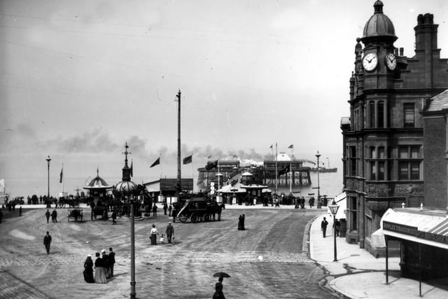 Smoke across the sea as a pleasure steamer leaves the North Pier jetty in this Victorian photograph taken from Talbot Square. It's 1885, no tram lines, possible gas lamp on right