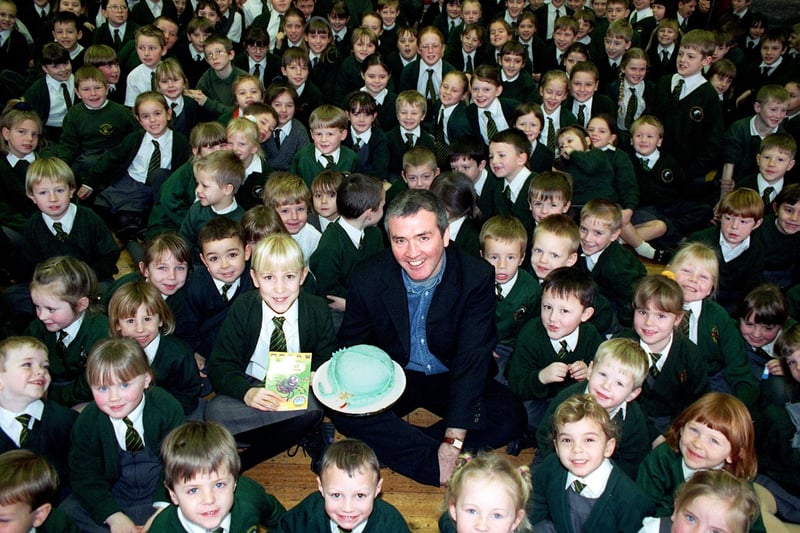 Children's author Tony Bradman visited Shakespeare School in Fleetwood after pupil Rachel Bamber (10) wrote a letter to him. The children found out that it was Tony's birthday just before his visit, and so presented him with a cake. Pic shows Tony and Rachel (centre) surrounded by admiring fans, 1998
