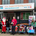 L to R Rachel Pendleton, Olivia Cartwright, Adam Garvey, Santa, Rosalina Lobo, Matthew Hoy, Fay Hudson and Kate O'Donnell