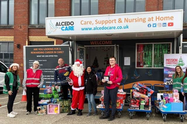 L to R Rachel Pendleton, Olivia Cartwright, Adam Garvey, Santa, Rosalina Lobo, Matthew Hoy, Fay Hudson and Kate O'Donnell