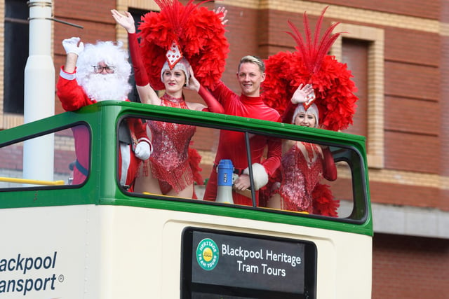 Reece Oliver and The Showboat Showgirls with Santa Claus on Blackpool Promenade today in an open top bus to celebrate the launch of their Christmas party nights and festive show. Photo: Kelvin Stuttard