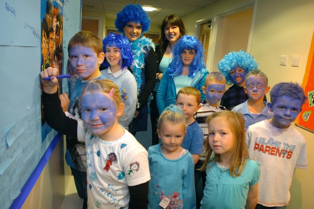 Pupils and Staff at Manor Beach Primary School in Cleveleys held a 'blue day' as part of their anti-bullying week. Pupils wait to sign their name on the Blue Pledge Board, 2008
