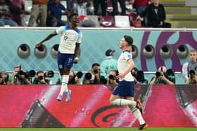 I'LL SECOND THAT: England's Bukayo Saka celebrates scoring the second goal against Group B rivals Iran with Declan Rice (right) at the Khalifa International Stadium. Picture: Nick Potts/PA