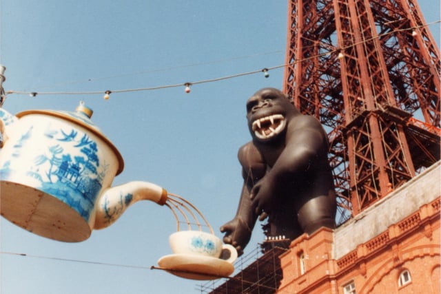 This guy... Perched at the foot of Blackpool Tower, King Kong was an 84ft inflatable gorilla who was in place in August 1984 as part of the Tower's 90s anniversary. This photo shows him having a cuppa courtesy of an illumination display. For tourists, they looked up in awe. For us locals, it was a shock to see at first but everyone loved it and he became a favourite during the summer season