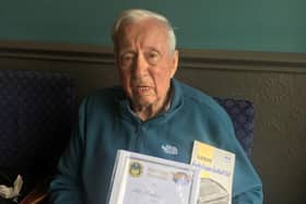 Alf Meakin with his Heritage Certificate and a copy of his debut programme