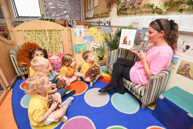 The Learning Tree Nursery on Whitehills Drive is celebrating their recent 'Outstanding' Ofsted report. Nursery practitioner Hannah Singleton  reads to the children.