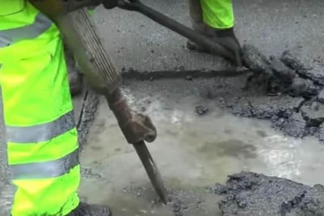 The men, posing as highways workers in hi-viz jackets, were found digging a hole in the pavement using shovels and a pneumatic jackhammer