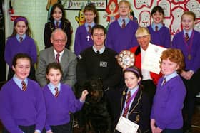 Elmslie Junior School had won the Blackpool Borough Council's Annual Award for responsible Dog ownership.  Coun Fred Jackson (seated left), Chairman of the Environmental Health and Public Protection Committee, presented pupils with a trophy and certificates at the school. Also seated are Dog Warden A Brown and Head Teacher Mrs S Hodges