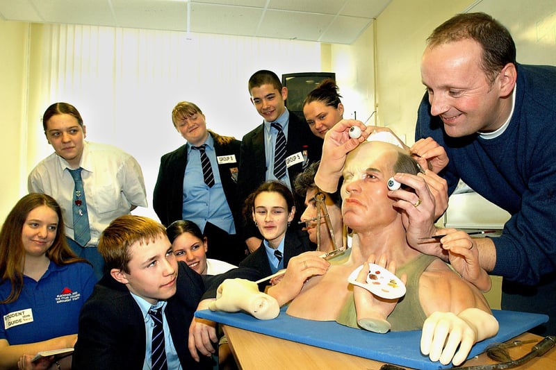 Skills Fair for local High School pupils at Blackpool and the Fylde College, organised by final year Travel and Tourism students. Mike Conroy (Sculptor/Designer, Louis Tussauds Waxworks), Blackpool) demonstrates his skills to 14 year old Dereck Gill (kneeling, front) and fellow Collegiate High School pupils