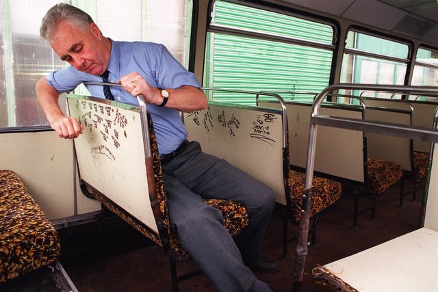 Body Shop supervisor Mike Airey inspects some of the £1000 monthly vandalism at the Rigby Road depot in 1999. The seating fabric is a blast from the past!
