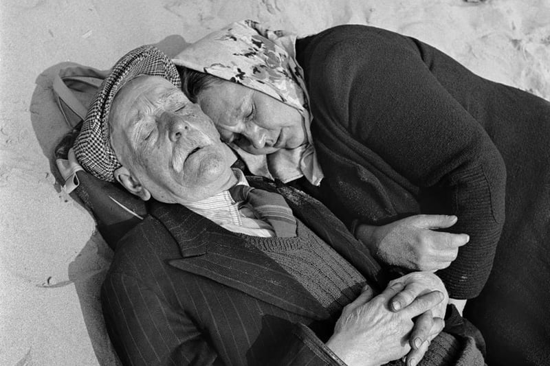 A fabulous picture of an elderly couple asleep on the beach, soaking up the warmth. A real moment in time. Photo: John Gay/Historic England/Mary Evans