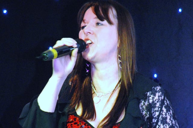 Shaunna Taylor singing on stage