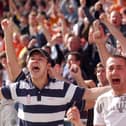Supporters celebrate Blackpool's crucial victory at the full-time whistle