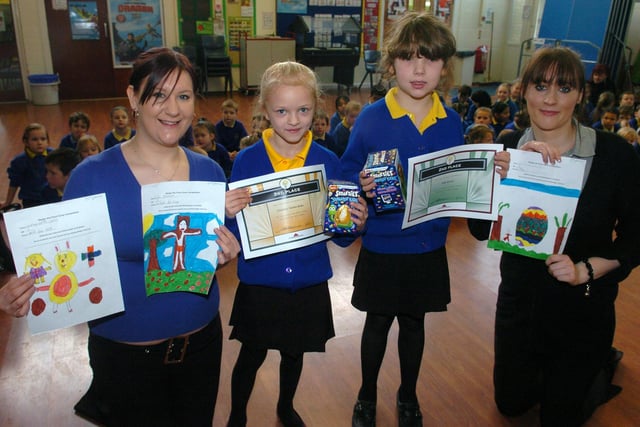 Youngsters at Christ the King School took part in an Easter poster competition, organised by Blackpool and the Fylde College for an NSPCC book. Pictured with their prizes are Courtney Garner-Jones (left) and Ellie Brown (right), with college students Sarah Shaw and Amanda Brown with the prizewinning entries