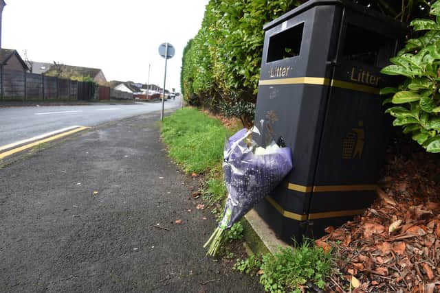 A bunch of flowers left at  Kilburn Drive, Shevington, where Liam Smith was found dead.