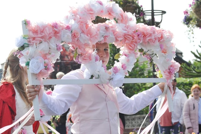 Members of the community take part in the Freckleton Club Day procession through the village.