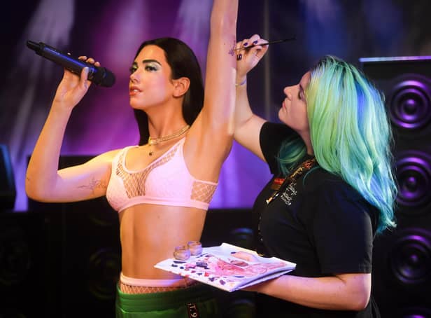 A waxwork of pop sensation Dua Lipa will be spending the summer at Madame Tussauds in Blackpool. Pictured is Emma Meehan putting the finishing touches to Dua Lipa.
