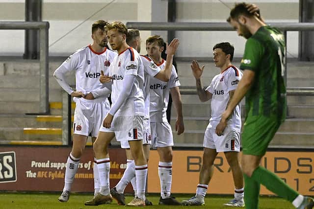 AFC Fylde celebrate their opening goal against Marine from Adam Lewis (right) Photo: STEVE MCLELLAN