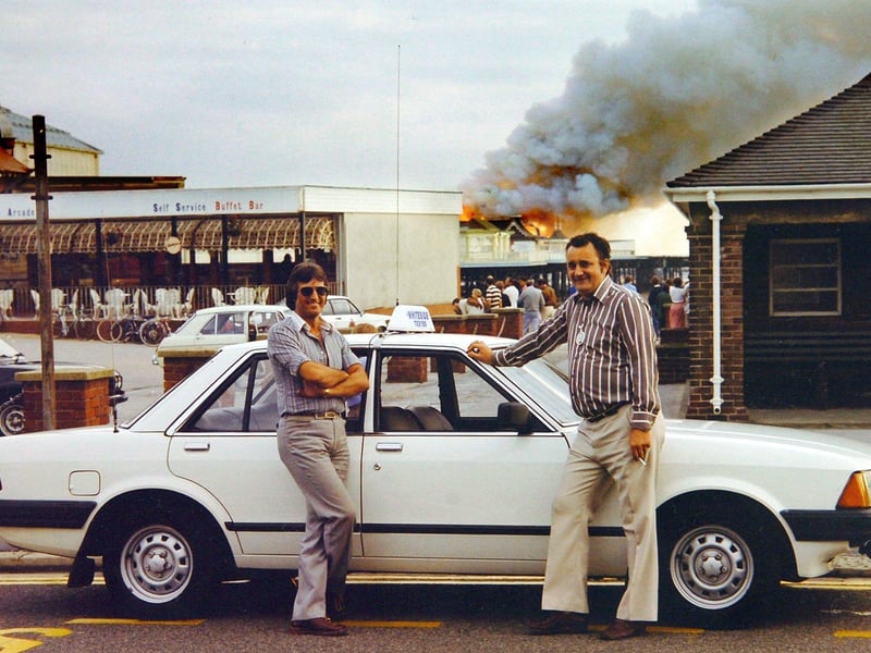 Whiteside's Taxis in St Annes was celebrating its centenary. Drivers Dave Glaze (left) and Dave Whitfield with a Ford Granada in front of the St Annes Pier fire in July 1982