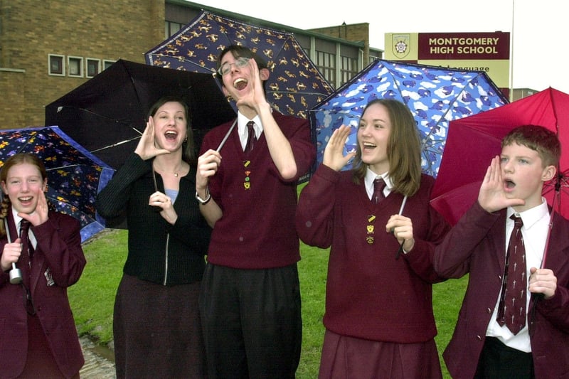 Pic to illustrate Montgomery High School good Ofsted report. Singing (the praises of their school)in the rain are from left, Laura Clark, English Teacher Angela Jackson, Paul Cox (head boy),  Clare Burton  (Head Girl) and James Fuller