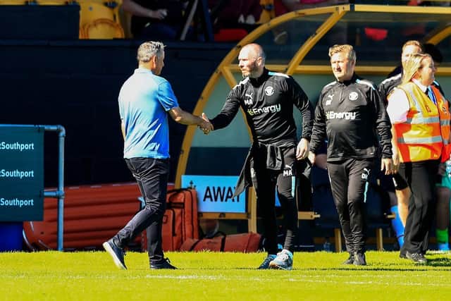 Michael Appleton shakes hands with Southport boss Liam Watson