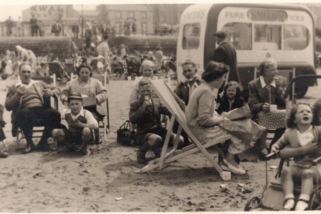 An ice-cream van, deckchairs and happy holidaymakers... a typical Blackpool scene on the sands from the 1950s. Photo: Barry McLoughlin collection