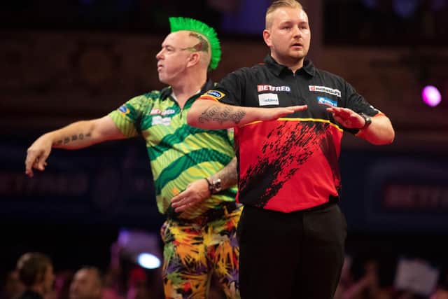 Dimitri Van den Bergh defeated reigning champion Peter Wright Picture: Taylor Lanning/PDC